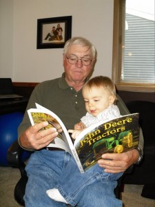 Grandpa Bob & Grandson Eli share a love of books and  tractors.